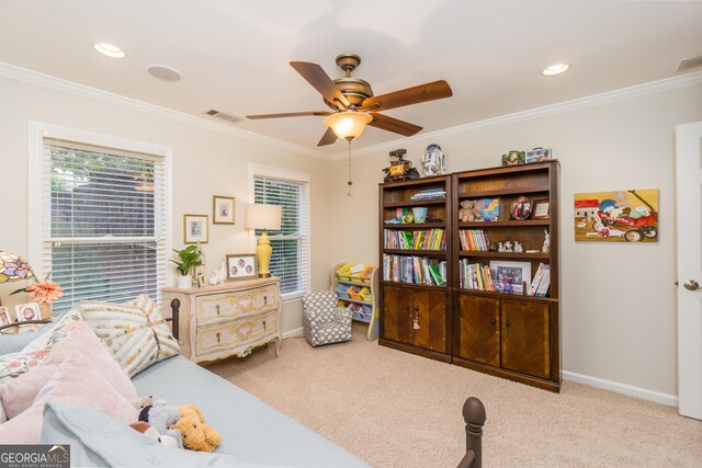 bedroom featuring light carpet, ceiling fan, and crown molding