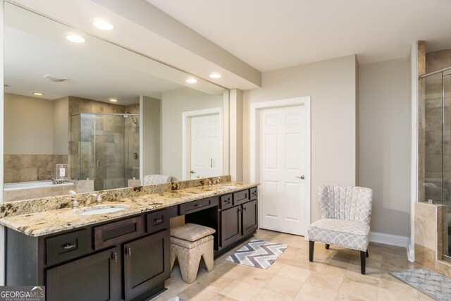 bathroom featuring tile patterned floors, vanity, and walk in shower