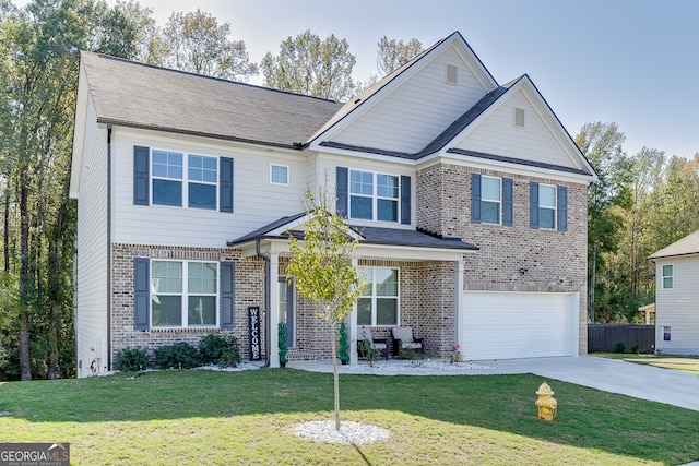 view of front of house with a garage and a front lawn