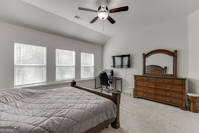 bedroom with ceiling fan, vaulted ceiling, and carpet