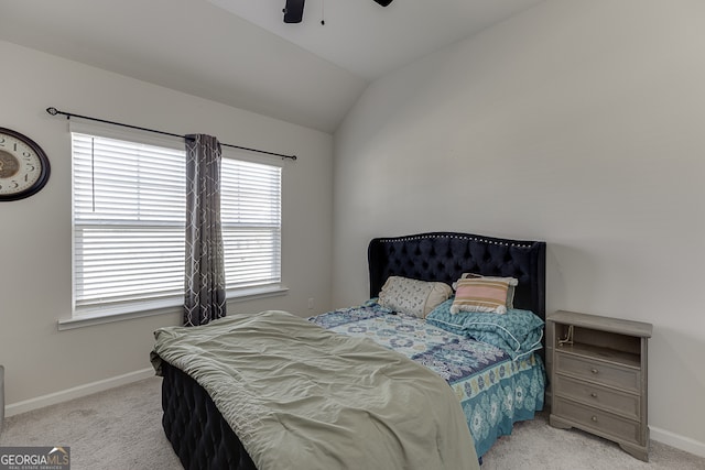 bedroom with light carpet, ceiling fan, and vaulted ceiling