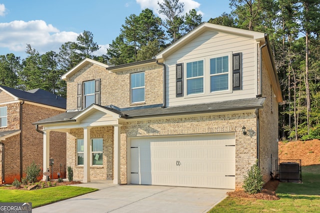 view of front facade featuring a front lawn and a garage