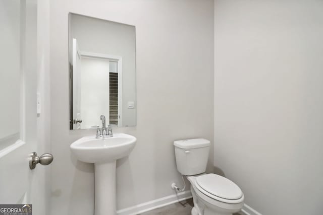 bathroom with toilet and sink