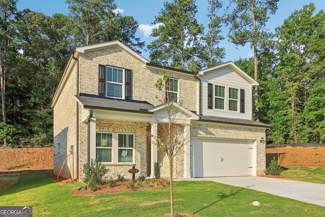 view of front of home with a front yard and a garage