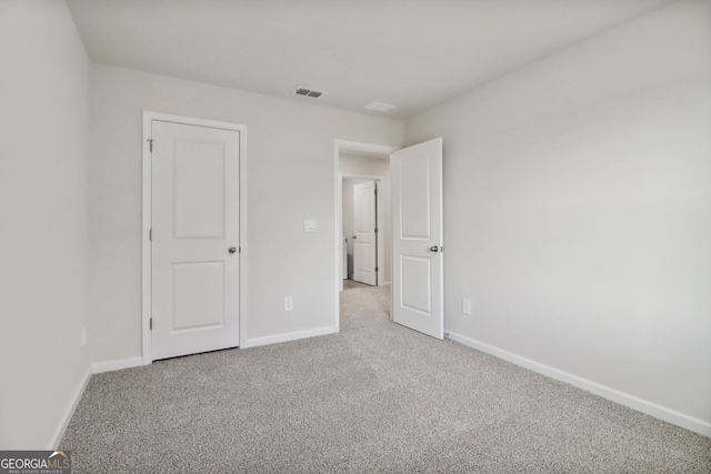 unfurnished bedroom with carpet