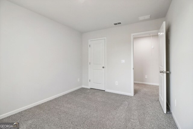 unfurnished bedroom with carpet