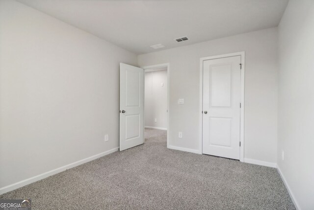 unfurnished bedroom featuring carpet