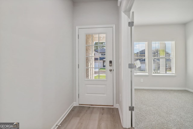 entryway with light hardwood / wood-style flooring