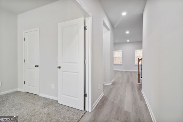 hallway with light hardwood / wood-style flooring