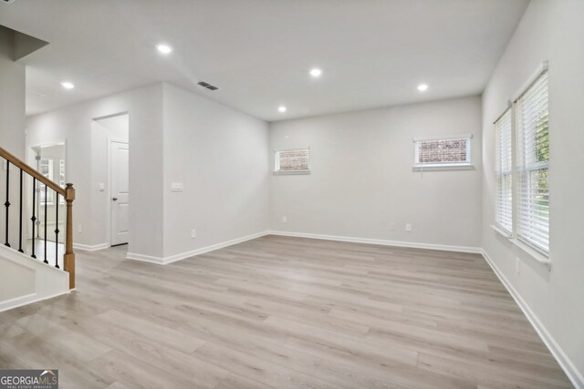 spare room featuring light wood-type flooring