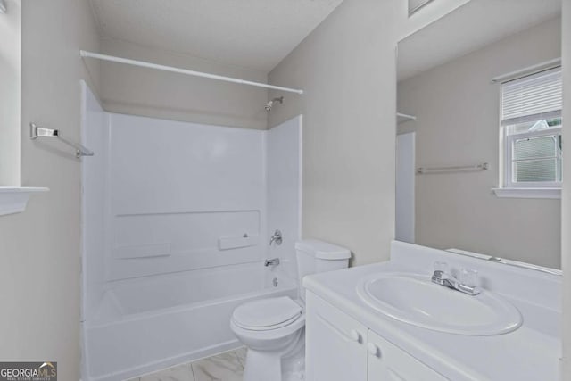 full bathroom featuring a textured ceiling, bathtub / shower combination, vanity, and toilet