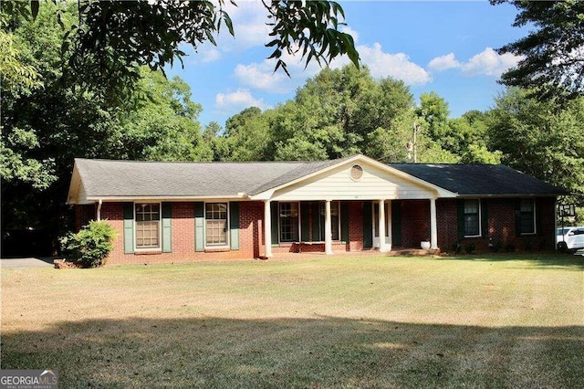 ranch-style home featuring a front yard and a porch