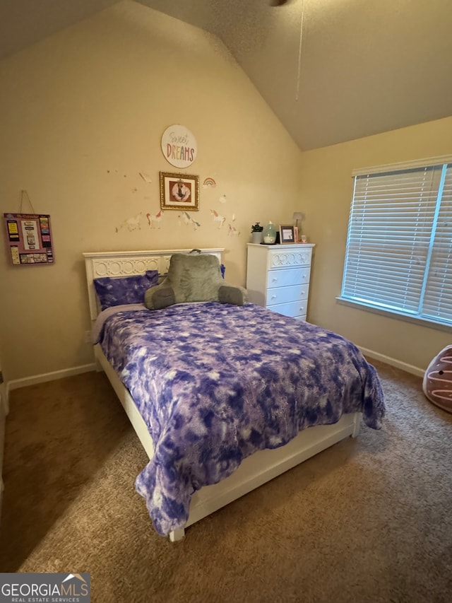 bedroom featuring carpet and vaulted ceiling