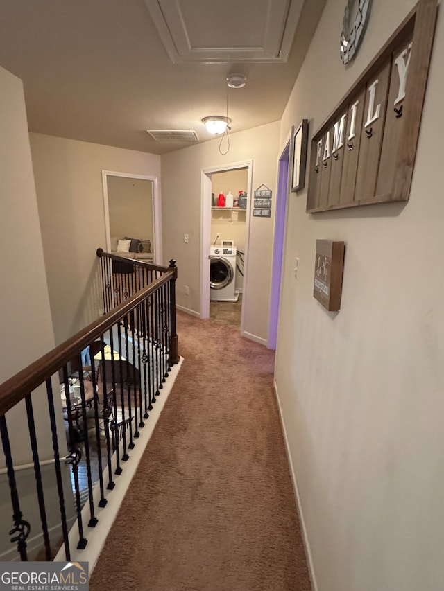 hall featuring washer / dryer and carpet flooring