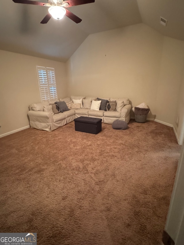 unfurnished living room featuring lofted ceiling, carpet, and ceiling fan