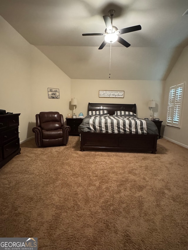 carpeted bedroom with vaulted ceiling and ceiling fan