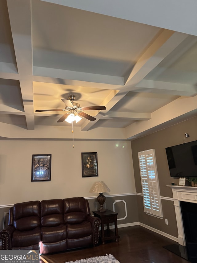 living room with beam ceiling, coffered ceiling, ceiling fan, and dark hardwood / wood-style flooring