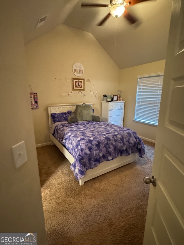 carpeted bedroom featuring lofted ceiling and ceiling fan