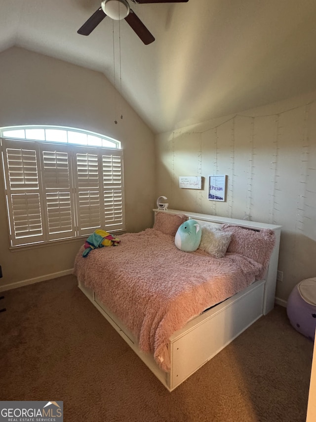 carpeted bedroom featuring ceiling fan and vaulted ceiling