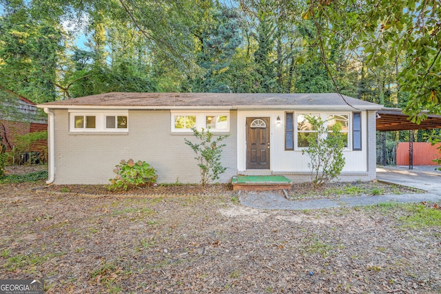 ranch-style house with a carport