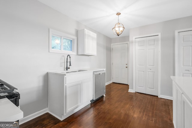 kitchen with pendant lighting, dark wood-type flooring, sink, white cabinets, and stainless steel dishwasher