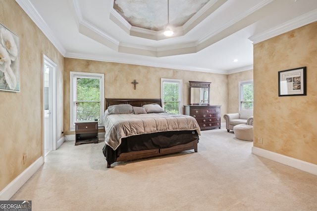 bedroom with crown molding, light colored carpet, and multiple windows