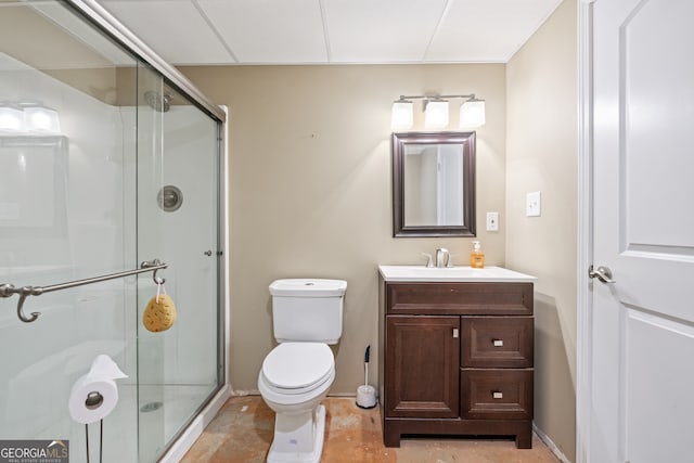 bathroom featuring vanity, toilet, and an enclosed shower