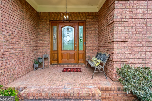 view of exterior entry featuring a porch