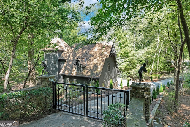 view of gate featuring a garage