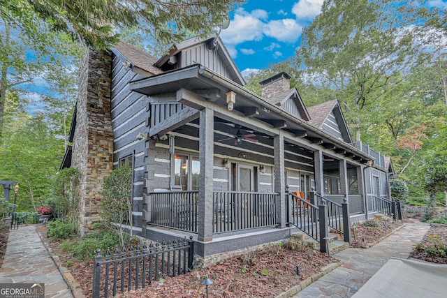 view of front facade with ceiling fan and a porch