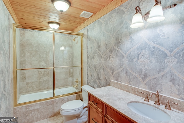 full bathroom featuring vanity, bath / shower combo with glass door, tile walls, wooden ceiling, and toilet