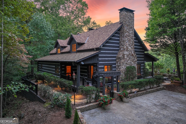 log-style house with a patio area