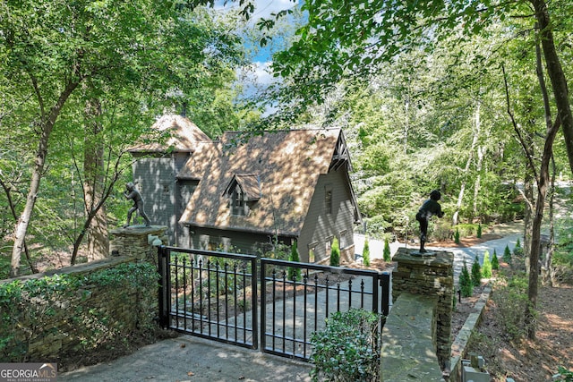 view of gate featuring a garage