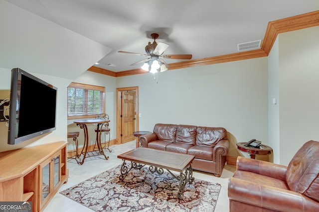 living room featuring ceiling fan, light tile patterned floors, and ornamental molding