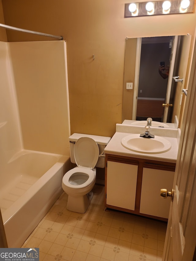 full bathroom with shower / washtub combination, vanity, and toilet