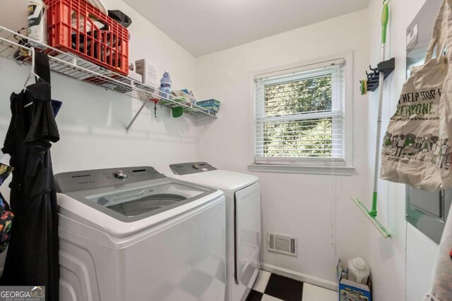 laundry room with washer and clothes dryer