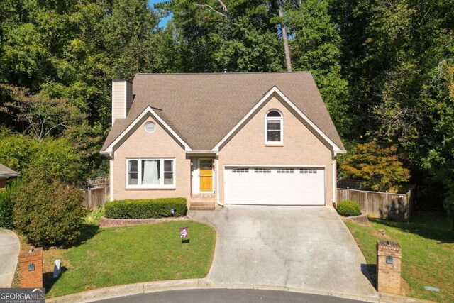 view of front of house featuring a garage and a front yard