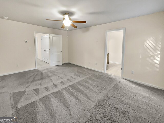 empty room with light carpet and ceiling fan