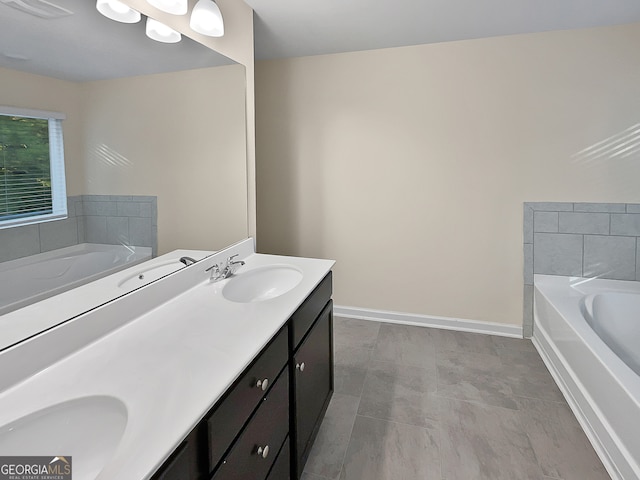 bathroom featuring a washtub and vanity