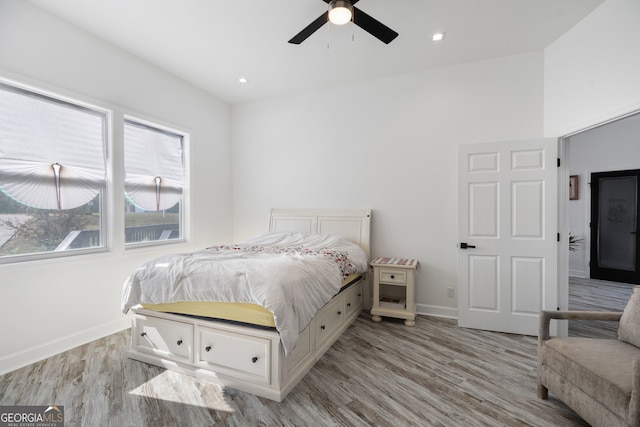 bedroom featuring light hardwood / wood-style flooring and ceiling fan