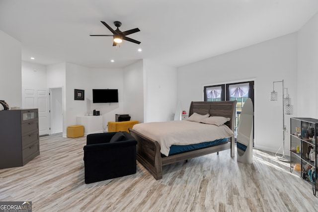 bedroom featuring light hardwood / wood-style floors and ceiling fan