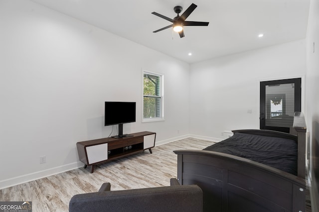 bedroom with light wood-type flooring and ceiling fan