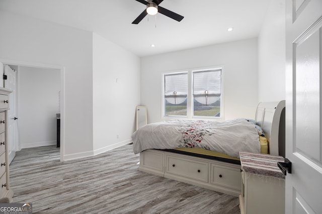 bedroom featuring light hardwood / wood-style flooring and ceiling fan