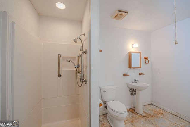 bathroom with sink, toilet, and walk in shower