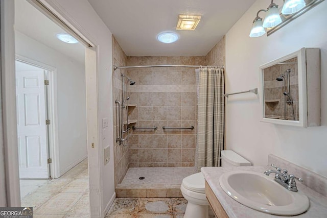 bathroom featuring vanity, toilet, and a shower with shower curtain