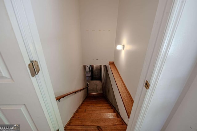 stairway featuring wood-type flooring