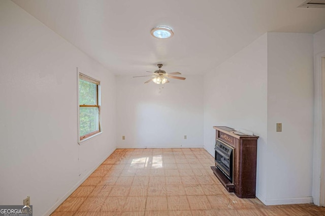 unfurnished living room featuring ceiling fan