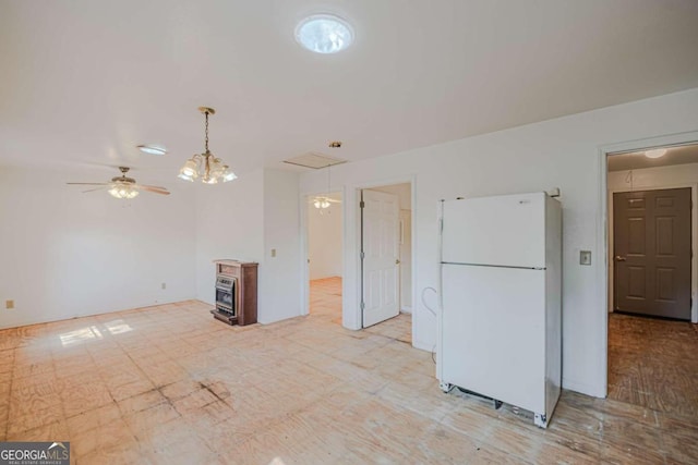 kitchen featuring pendant lighting, white fridge, and ceiling fan