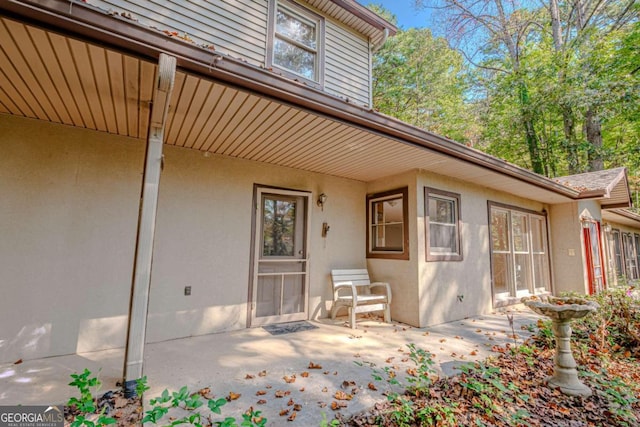 entrance to property with a patio