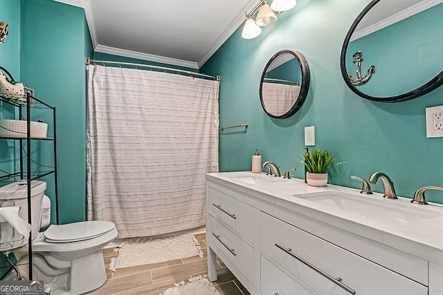 bathroom with hardwood / wood-style floors, vanity, a shower with curtain, crown molding, and toilet